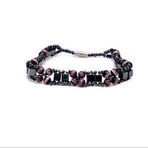 Beaded floral black and purple bracelet